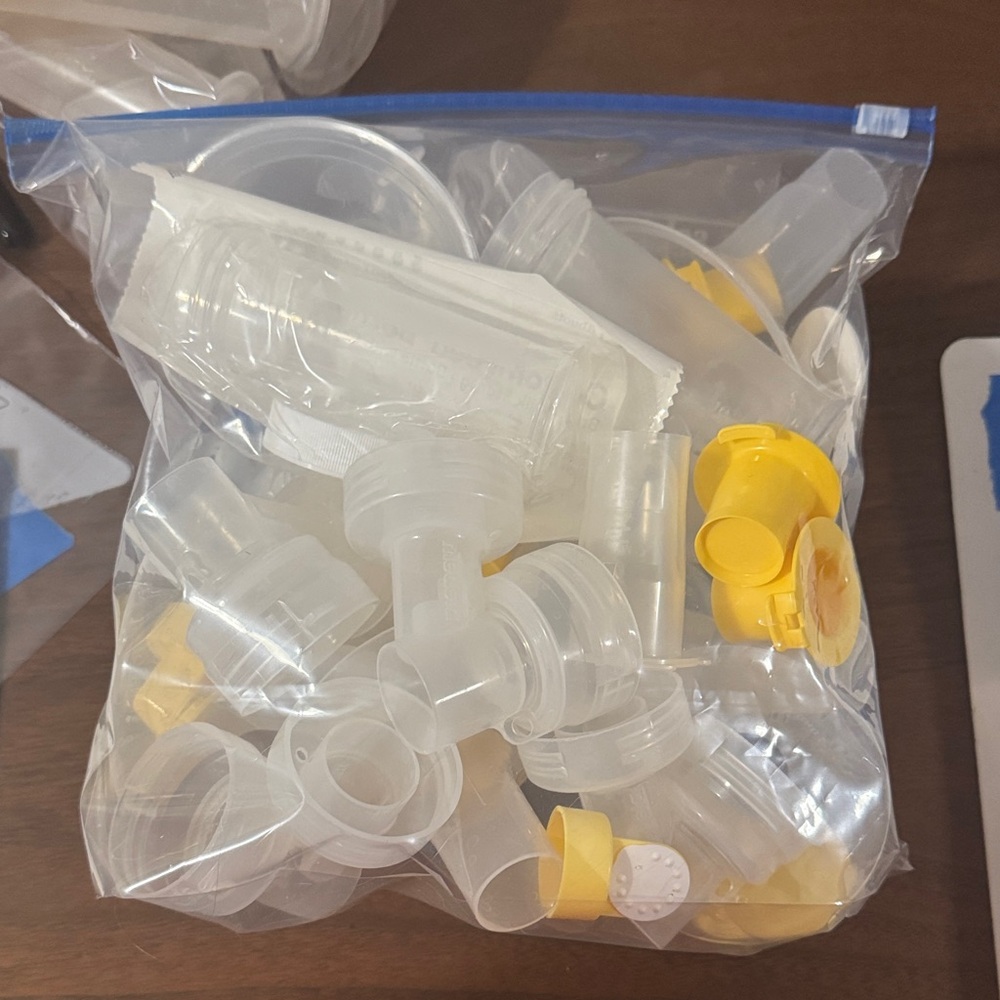 Medela Breast Pump Parts in Clear and Yellow